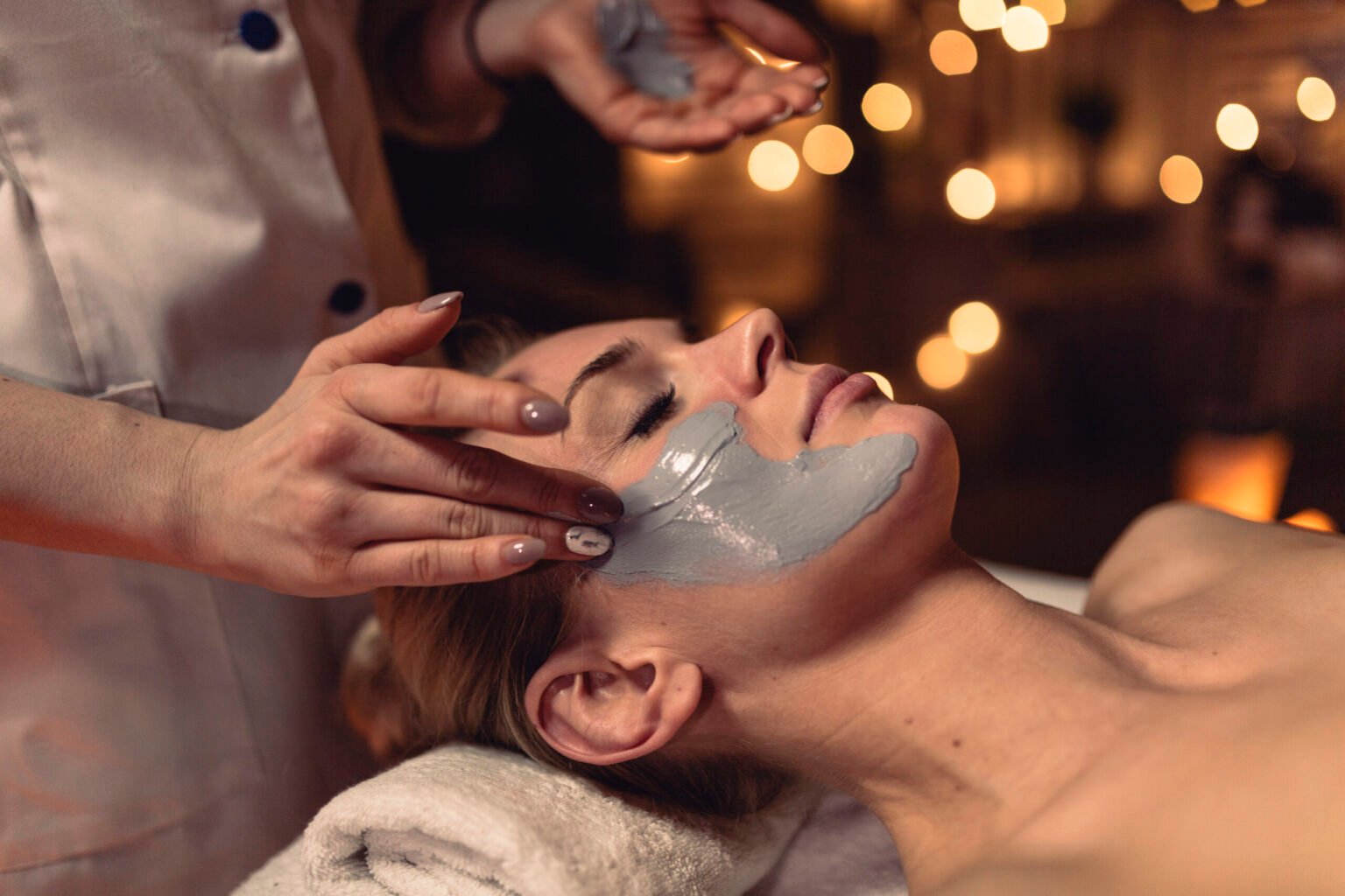 spa concept with woman with creme face